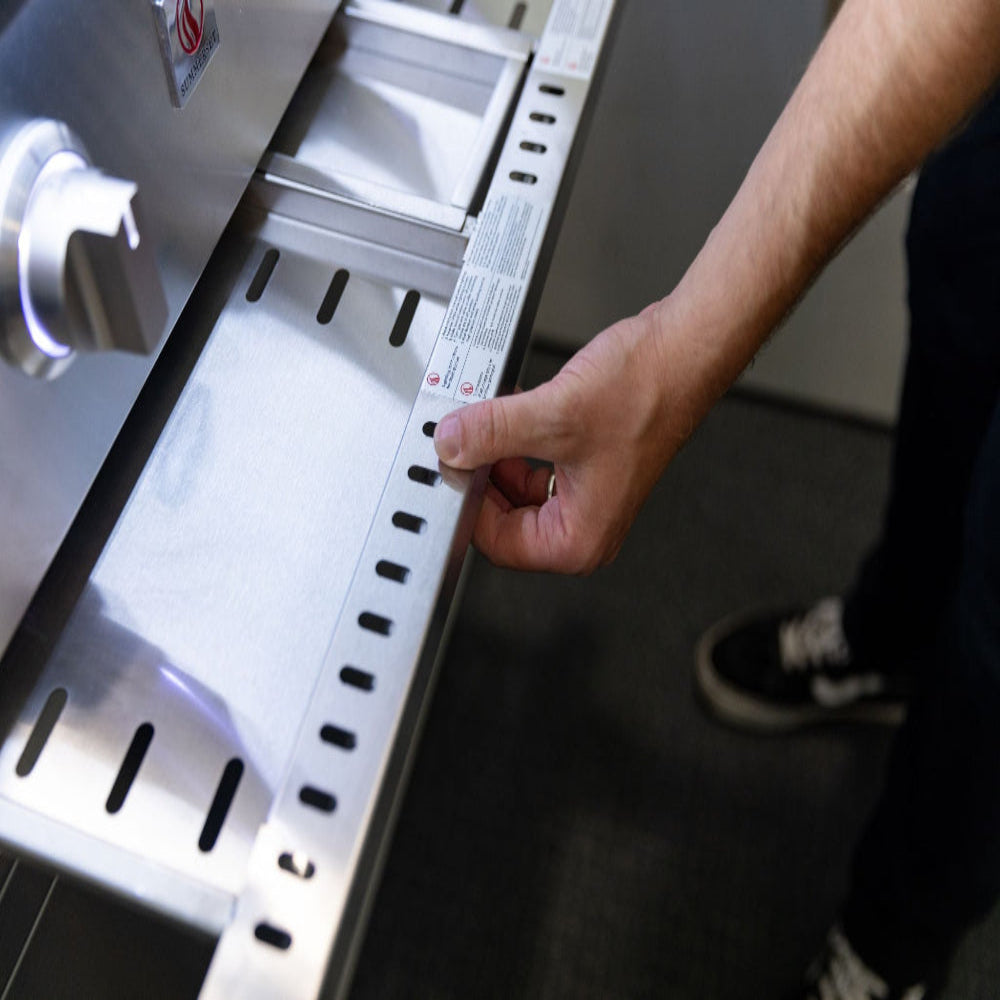 Removable drip tray being pulled out of the Summerset Quest grill