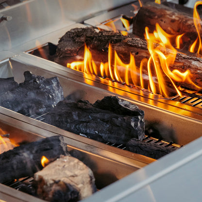 Burning wood chunks and charcoal in the American Made Grills Muscle hybrid grill fuel trays