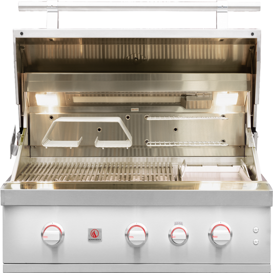 Summerset Quest 36-inch gas grill with hood open, illuminated interior and cooking accessories