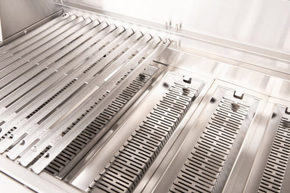 Close-up of stainless steel cooking grates and fuel trays inside an American Made Grills Muscle grill