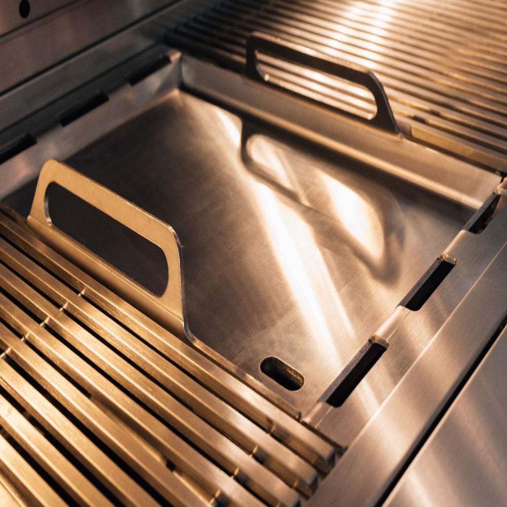 Summerset Quest stainless steel griddle plate installed beside cooking grates